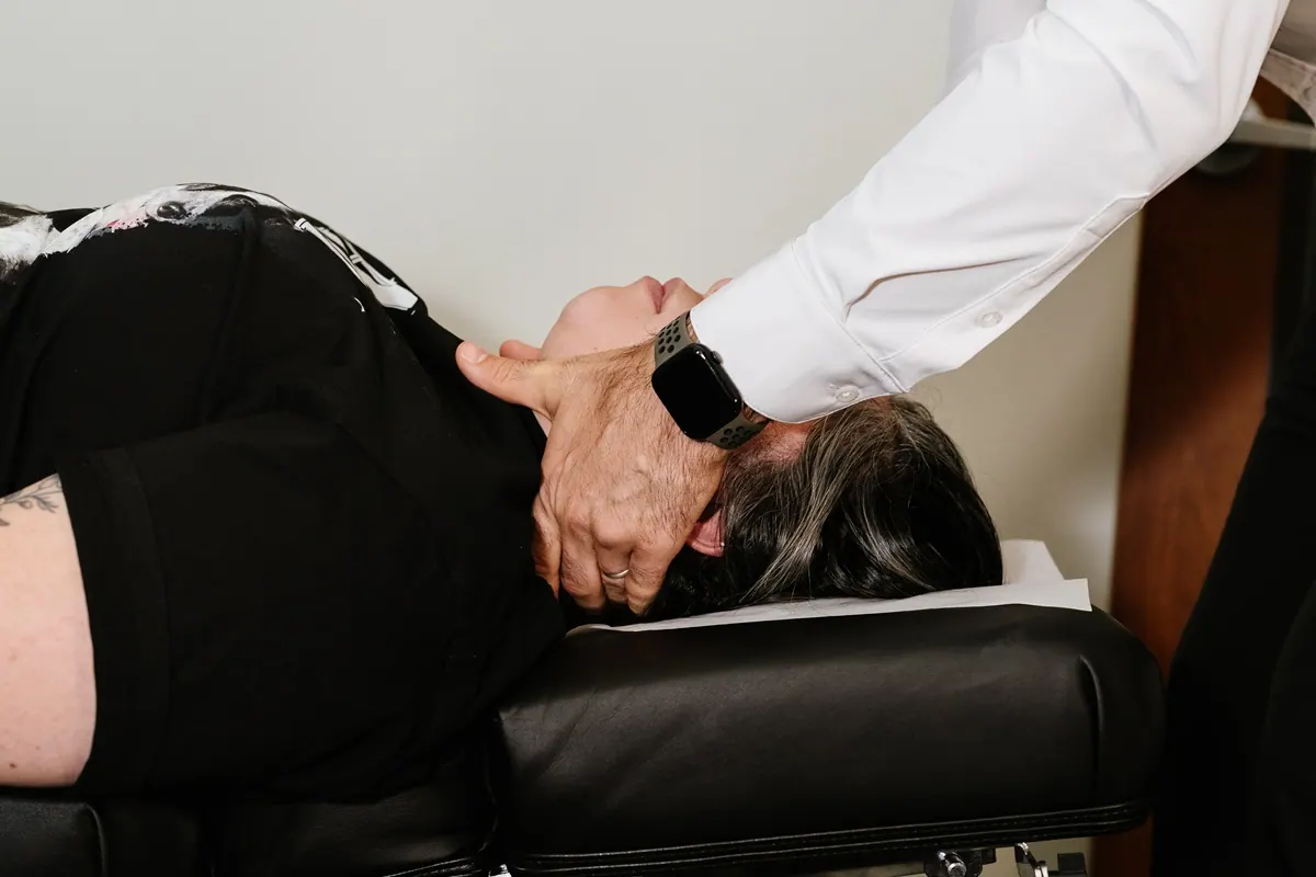 Chiropractor Performing Cervical Spine Adjustment