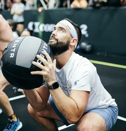 Athletic Man Performing Medicine Ball Exercise