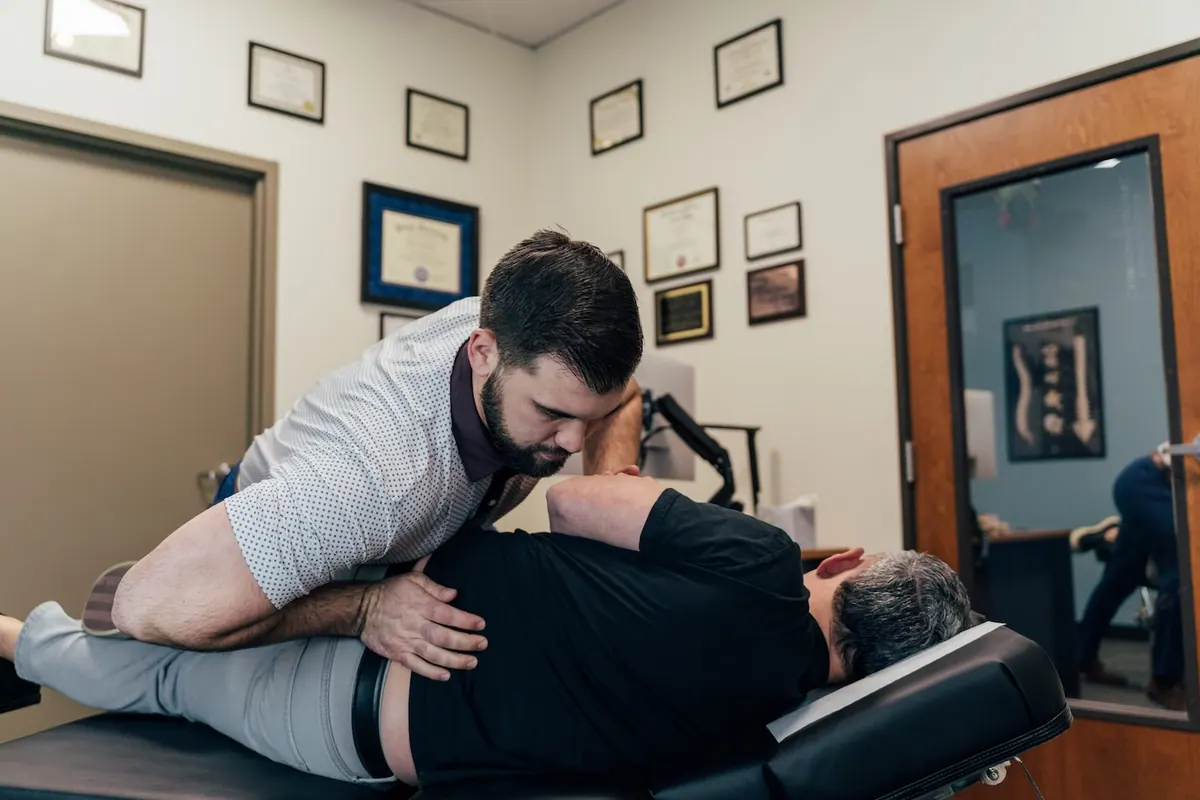 Chiropractor Performing Spinal Adjustment Treatment