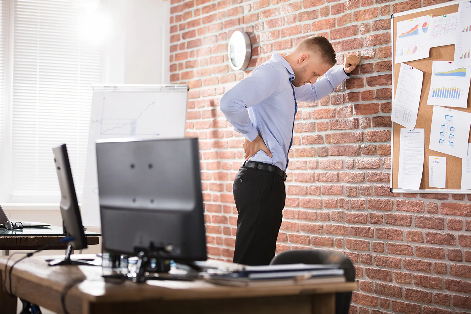a man suffering from herniated disc after his work