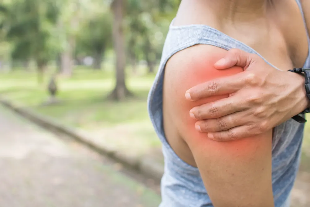 a woman suffering from overuse pain